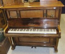 An upright Bluthner piano in a rosewood case with brass sconces   CONDITION REPORTS  Overall with