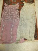 WITHDRAWN.  Two circa 1920's silk and beadwork flapper dresses in pink and cream, together with