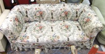 A late Victorian Chesterfield sofa with floral loose cover plus a mahogany bookcase and a gilt