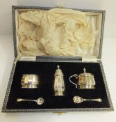 A mid 20th Century cased silver cruet comprising salt, pepper and lidded mustard (by Adey