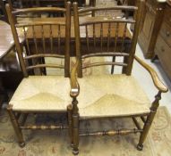 A set of eight stained beech spindle back chairs with rush seats in the 18th Century manner (7