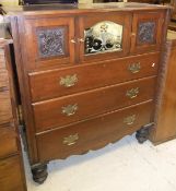 A mahogany chest of three drawers with three cupboard doors above in the Victorian manner raised