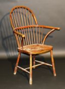 An early 20th Century Thames Valley stained beech hoop and spindle back chair with single bow arms