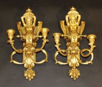 A pair of 19th century gilt wood and gesso figural wall sconces, 44 cm long.