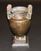 A 19th Century bronze "Etruscan" urn, the scrolling handles with swan neck terminals, 28 cm high,