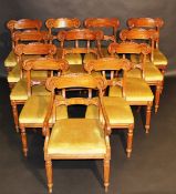 A set of twelve 19th Century mahogany bar back dining chairs in the late Regency taste, the drop-