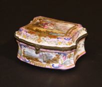 A late 19th Century Dresden porcelain dressing table box of waisted form, the lid decorated with