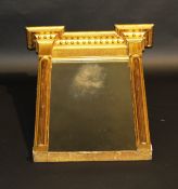 A 19th Century giltwood and gesso framed pier glass, the moulded and bowl decorated cornice over a