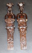 A pair of 18th Century Flemish carved pilasters as a semi-naked man with ships wheel and semi-