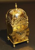 An early 20th Century brass cased lantern clock in the 17th Century style, the single fusée movement