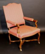 An 18th Century Continental walnut framed hall chair with upholstered high back and open arms with