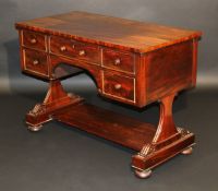 A George IV mahogany writing table, the plain top above five drawers and kneehole with turned knob