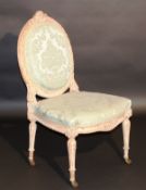 A 19th Century carved giltwood framed salon chair in the Louis XVI taste, the oval upholstered