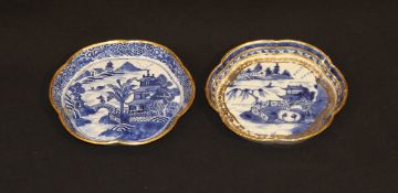 Two 19th Century Chinese blue and white and gilt decorated saucers of lobed design, 14.5 cm and 14