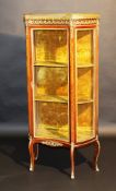 An early 20th Century mahogany and gilt brass embellished vitrine in the Louis Philippe taste, the