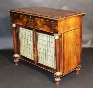 A late Regency rosewood and brass inlaid secretaire collectors cabinet, the cross banded top with