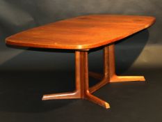 A circa 1980 Danish teak extending dining table, the rounded rectangular top, with two extra leaves,