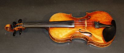 A early 20th century violin labelled Carlo Bergonazi, Cremona 60cm.   CONDITION REPORTS  Has wear