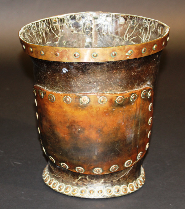 An 18th Century studded leather and copper bound bucket, 28.5 cm.