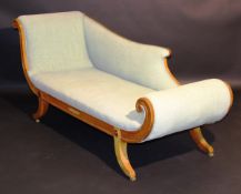 A 19th Century Scandinavian satin birch framed chaise longue in the Regence taste, with moulded show