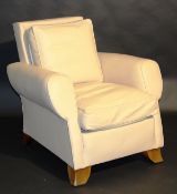 An early 20th century French Art Deco leather upholstered armchair by Dominique raised on square