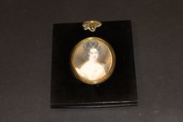 19TH CENTURY ENGLISH SCHOOL "Lady with ringlets in white dress, a rose at her breast", miniature