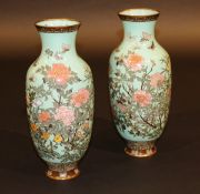 A pair of 19th Century Chinese cloisonné baluster shaped vases decorated with chrysanthemums and