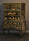 An 18th Century oak black lacquered and chinoiserie decorated chest on chest, the upper section with