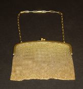 A gilt metal mesh evening bag with blue cabochon stone set clasps (bears three rubbed marks) 10 oz.