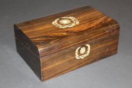 A 19th Century coromandel writing slope with mother of pearl inlay and vacant shield shaped