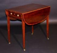 A Regency mahogany drop leaf Pembroke table, the rounded rectangular drop leaf top cross banded,