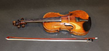 An un-named 19th century violin and an un-named bow 60 cm.   CONDITION REPORTS  Violin shows general