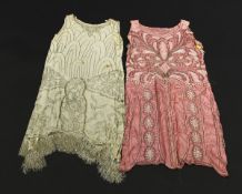 A 1920's pink silk "Flapper" dress with ornate silvered and pearlised beadwork decoration and shaped