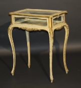 A circa 1900 French painted and gilded bijouterie table in the Louis XV taste, the rising top with