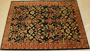 A Ziegler design carpet, the central panel set with all over floral decoration on a black ground