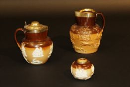 A Royal Doulton stoneware jug with relief work decoration and silver lid and mounts (by Samuel