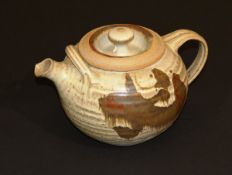 A 20th Century British studio pottery teapot bearing impressed marks "CR" and "Beehive", 17 cm
