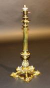 A 19th Century brass lamp base, the tapered fluted and baluster shaped acanthus decorated column