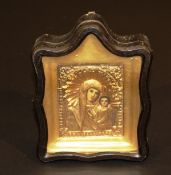 A 19th Century Russian icon of the Madonna and child with painted faces and gilt metal halo and