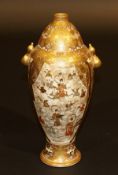 A Japanese Meiji period Satsuma ware vase of unusual stylised gourd form, the narrow neck over an