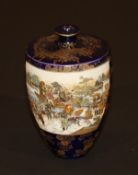 A Japanese Meiji period Satsuma ware vase in the manner of Kinkozan, the urn shaped body with narrow