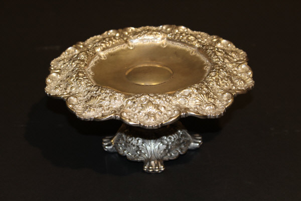 A Tiffany & Co. silver and silver plated tazza, the top with wide heavy set floral and C scroll