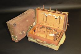 An early 20th Century leather travel case initialled "F M", with fitted interior containing