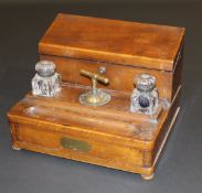 A 19th Century walnut desk stand by S. Morden & Co. with integral crest, the sloping hinged top