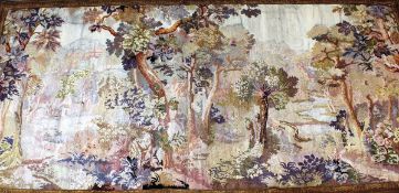 An early 18th Century French verdure tapestry in the Aubusson manner, depicting a woodland scene