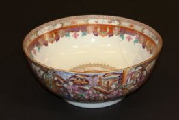 A Chinese Qianlong export punch bowl, the centre field decorated with figures in a garden setting