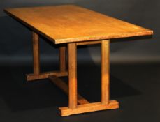 A Gordon Russell oak refectory style dining table, the plain top on twin octagonal end pedestal