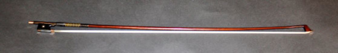A gold and mother of pearl mounted violin bow.   CONDITION REPORTS  Shows some signs of use, with