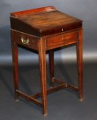 A 19th Century mahogany clerks desk, the three quarter galleried top above a sloping fall