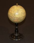 A 19th Century French terrestrial globe by E. Bertaux inscribed "E. Bertaux Editeur, Rue Serpente